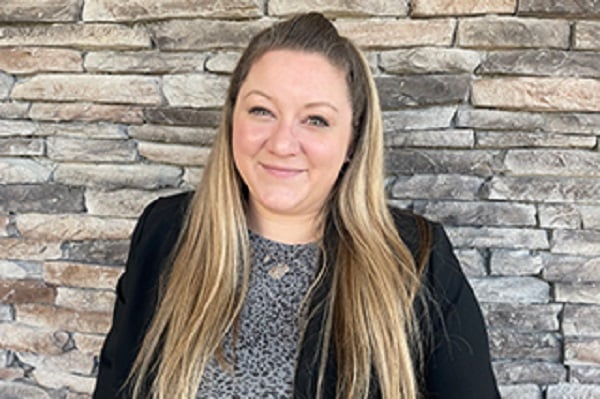 Katelyn, insurance and marketing director, smiling at the dental office
