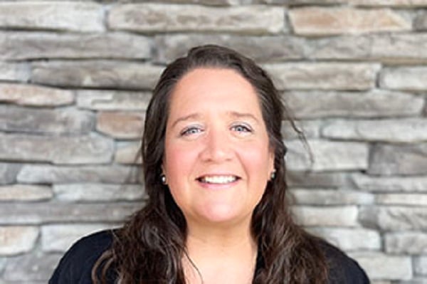 Stephanie, patient care coordinator, smiling at the dental office