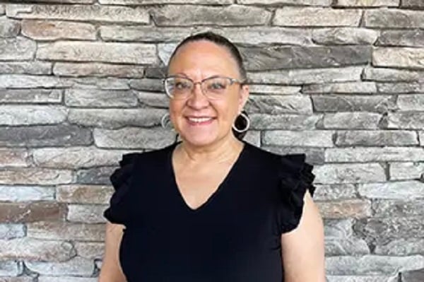 Tammy, patient care coordinator, smiling at the dental office