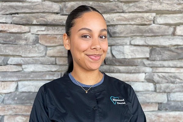 Melanie, dental assistant, smiling at the dental office