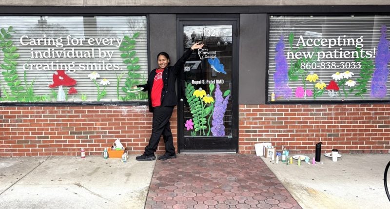 Team welcoming new patients with flowers and cheerful display