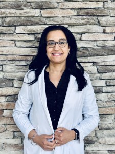 Dr. Muneet K. Nanda smiling in professional headshot