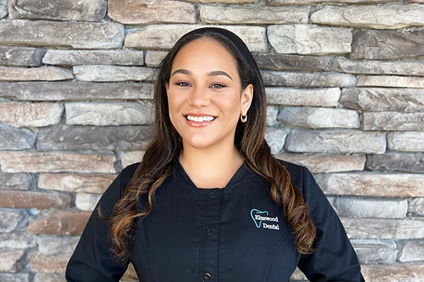 Jackie, dental hygienist, smiling at the dental office
