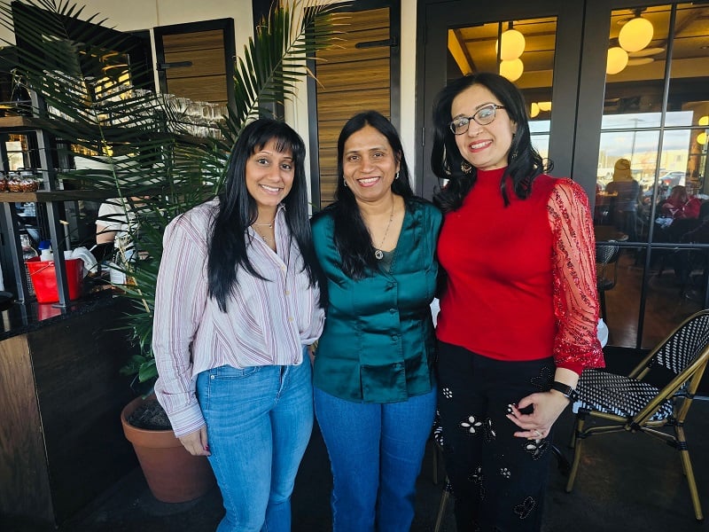 Dr. Rupal S. Patel, Dr. Muneet K. Nanda, and Dr. Nayaki Gaddipati smiling together at the dental office